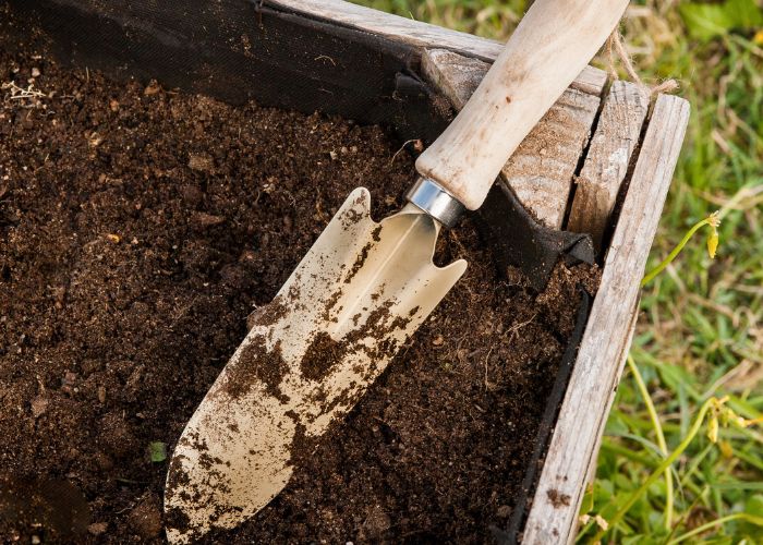 a small garden spade in soil