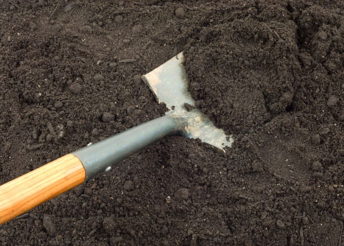 digging soil in garden